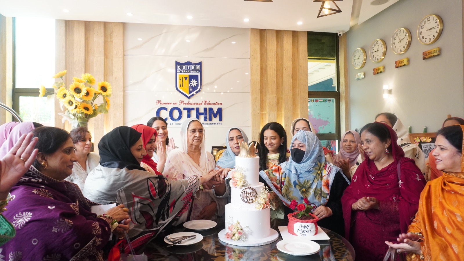 Cake cutting ceremony at COTHM Mother’s Day celebration