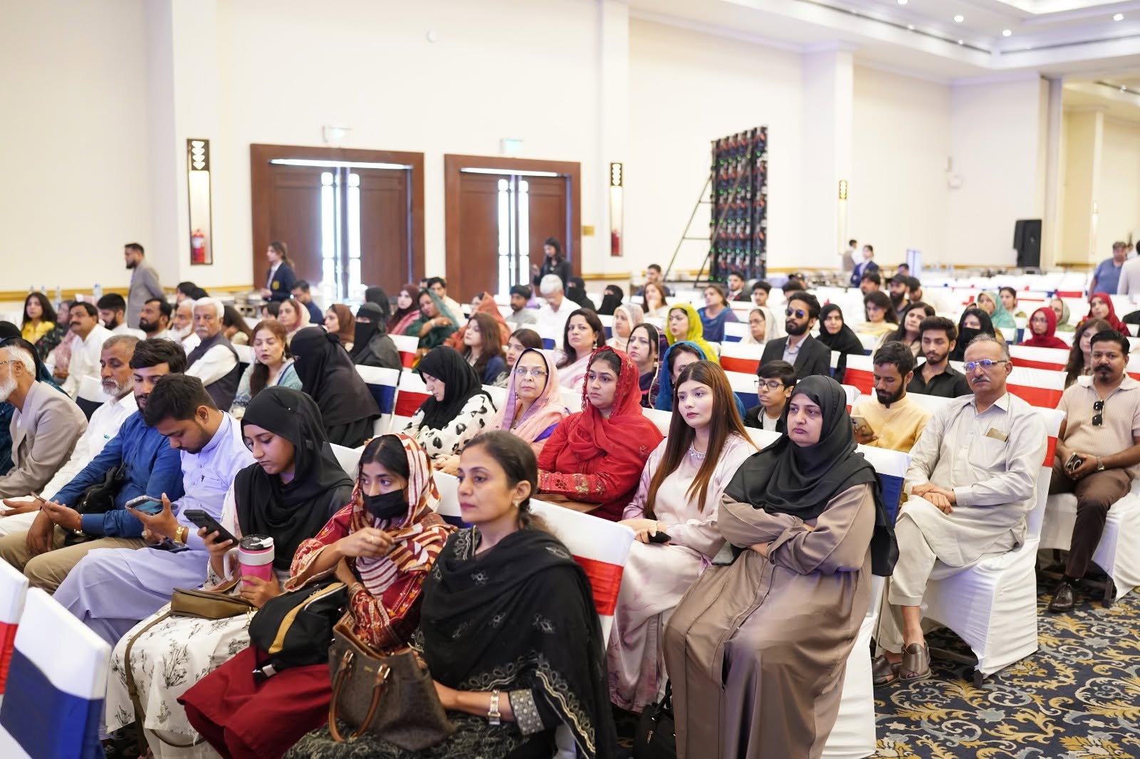Parents and students celebrating achievements at COTHM graduation ceremony