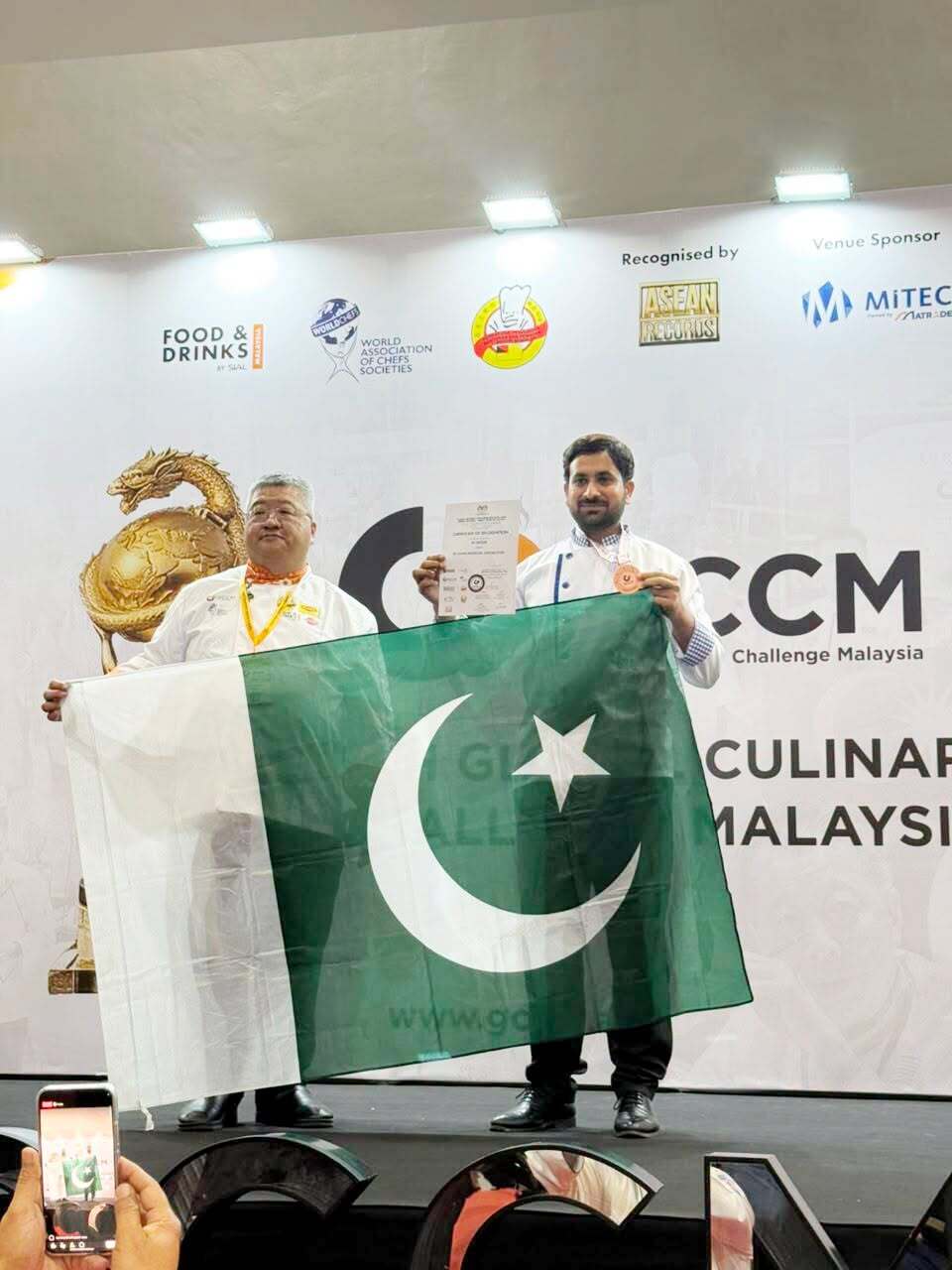 COTHM culinary participants carrying Pakistan flag in Malaysia