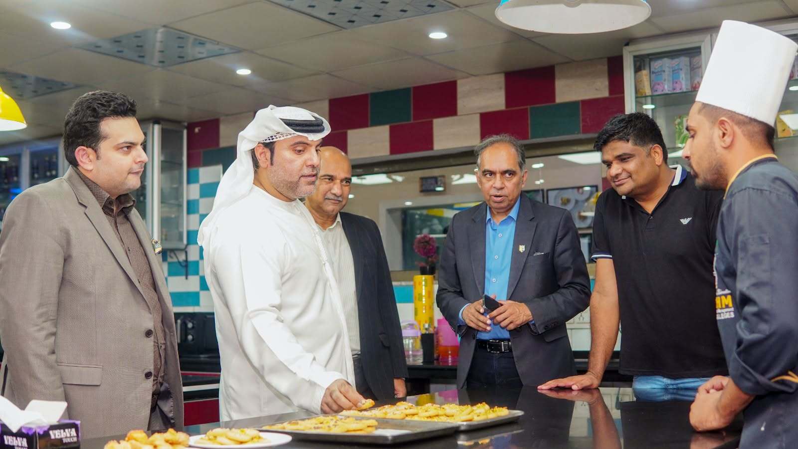 Dr Bu Abdullah touring COTHM hospitality training facilities
